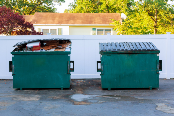 two green dumpsters