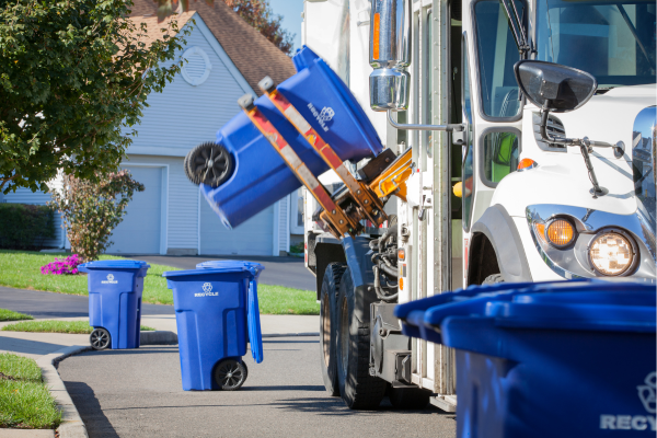 recycling truck lifting blue recycling cart