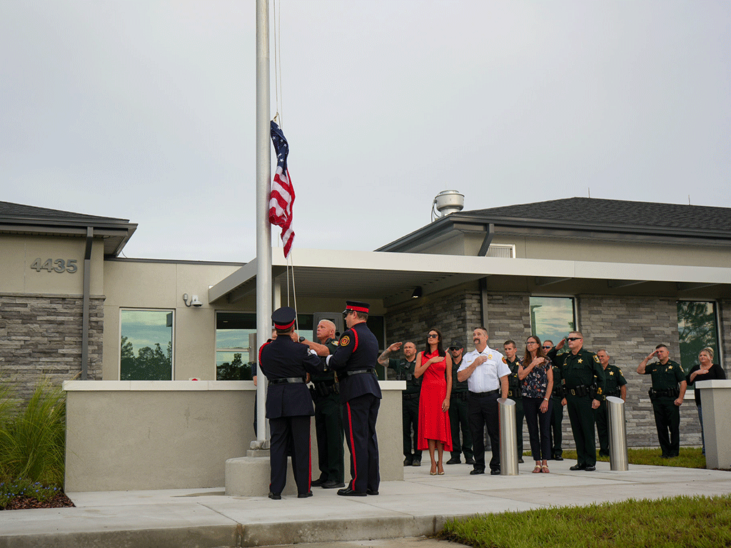 Ceremonial flag raising at fire rescue station and sheriff's office operations center grand opening