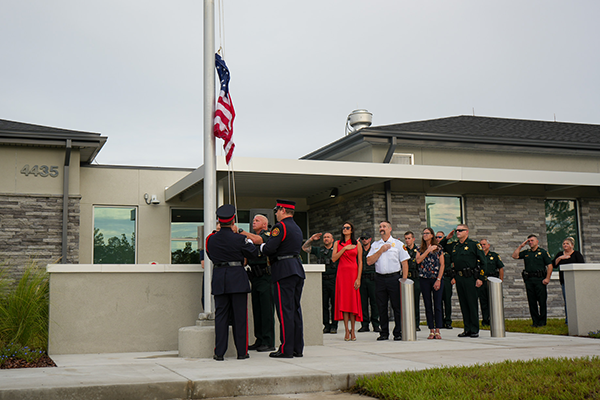 Ceremonial flag raising at fire rescue station and sheriff's office operations center grand opening