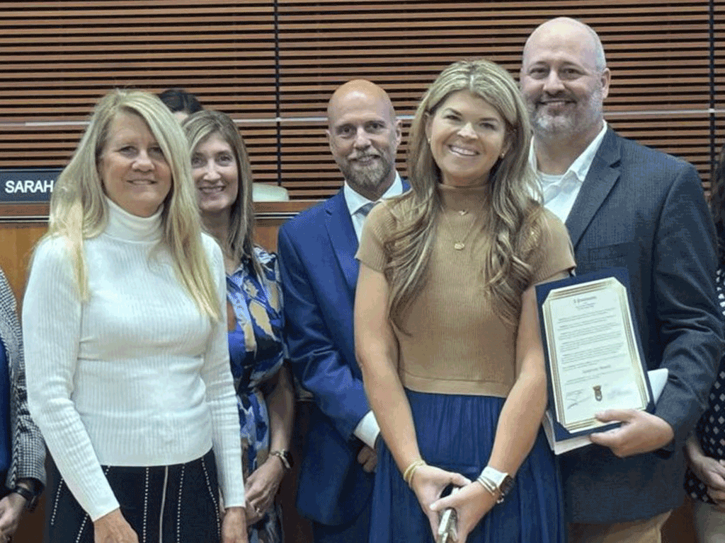 Commissioner Krista Joseph joined by Maggie Litchney and others to receive the honor for the presentation of the proclamation.