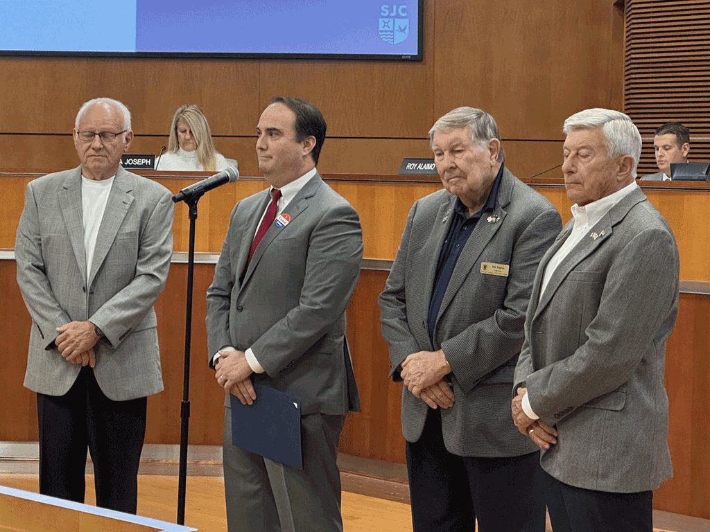 Bill Dudley and Joseph McDermott join Commissioner Christian Whitehurst to accept the honor of the Veterans Day proclamation.