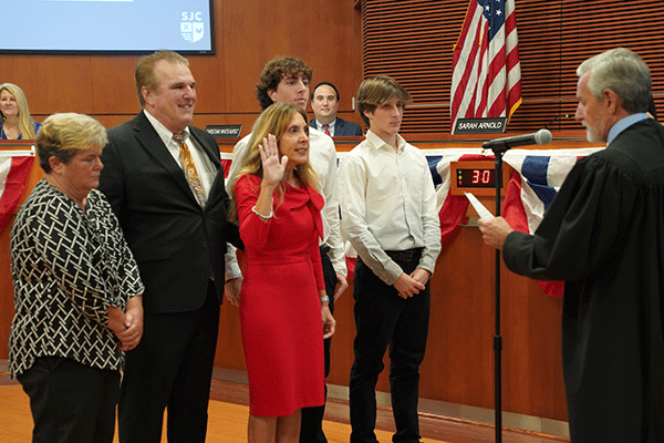 Commissioner Ann Taylor taking oath