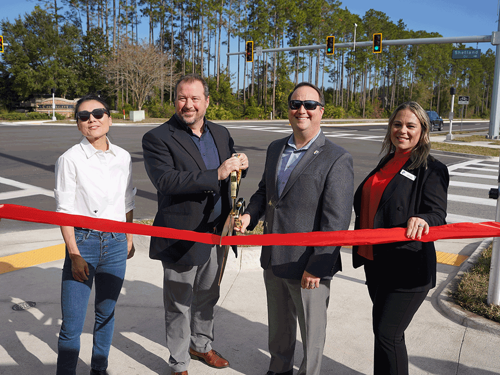 County Administrator Joy Andrews, Commissioner Whitehurst, Project Manager Valerie Pacetti, and Public Works Director Greg Caldwell cut the ribbon at the Longleaf Pine Parkway Widening project.