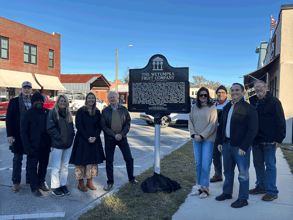 Commissioner Arnold, Commissioner Christian Whitehurst, Commissioner Clay Murphy, Commissioner Krista Joseph, Hastings Main Street Chair Jena Davis, and Gregory and the new Wetumpka Fruit Company signage.