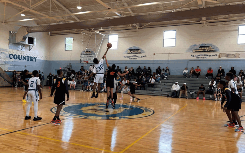 a youth basketball game in a gymnasium.