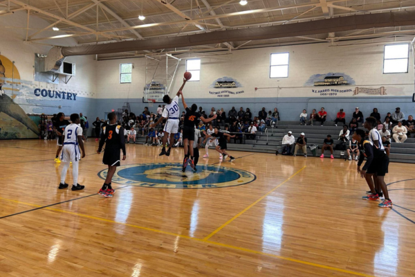 A youth basketball game in a gymnasium