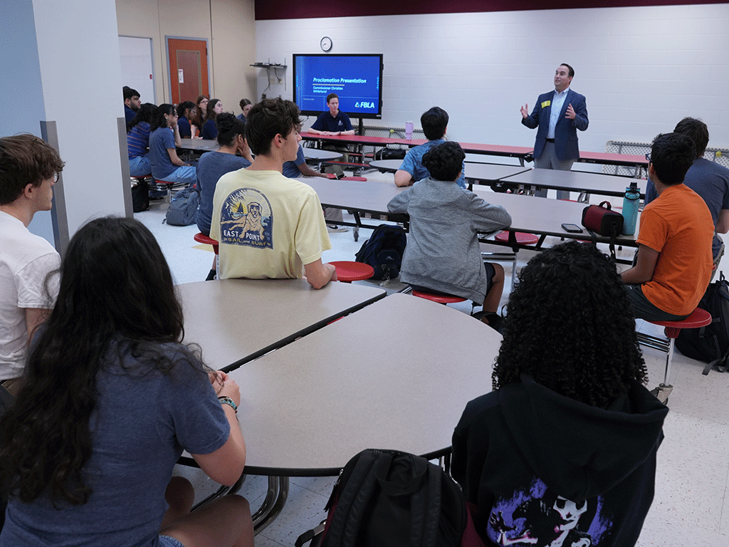 Commissioner Christian Whitehurst speaking to students